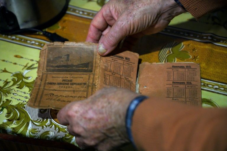 Russian descendant Alejandro Sabelin shows the passport of his grandfather at his house in San Javier, Uruguay