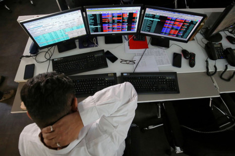 A broker reacts while trading at his computer terminal at a stock brokerage firm in Mumbai, India, December 11, 2018. 