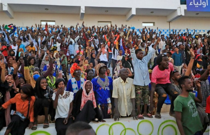 Fans watch Sudan's women's national team play in Khartoum -- people in the country have "become more accepting of women's football," coach Salma al-Majidi says