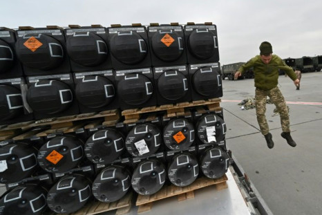 A Ukrainian serviceman at work receiving the delivery of FGM-148 Javelins, US man-portable anti-tank missiles provided by US to Ukraine as part of a military support, at Kyiv's airport on February 11