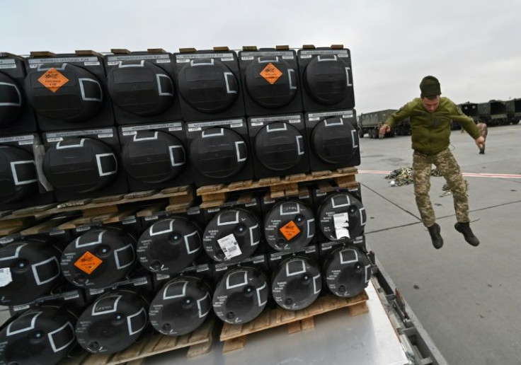 A Ukrainian serviceman at work receiving the delivery of FGM-148 Javelins, US man-portable anti-tank missiles provided by US to Ukraine as part of a military support, at Kyiv's airport on February 11