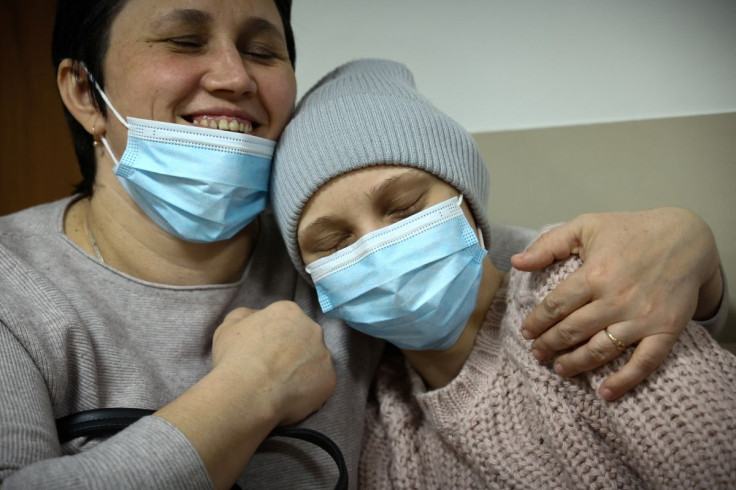 Ukrainian Alinka, 17, and her mother Katya wait outside the examination room of children's oncology ward at the Institute of Mother and Child hospital in Warsaw, Poland March 3, 2022. Picture taken March 3, 2022. 