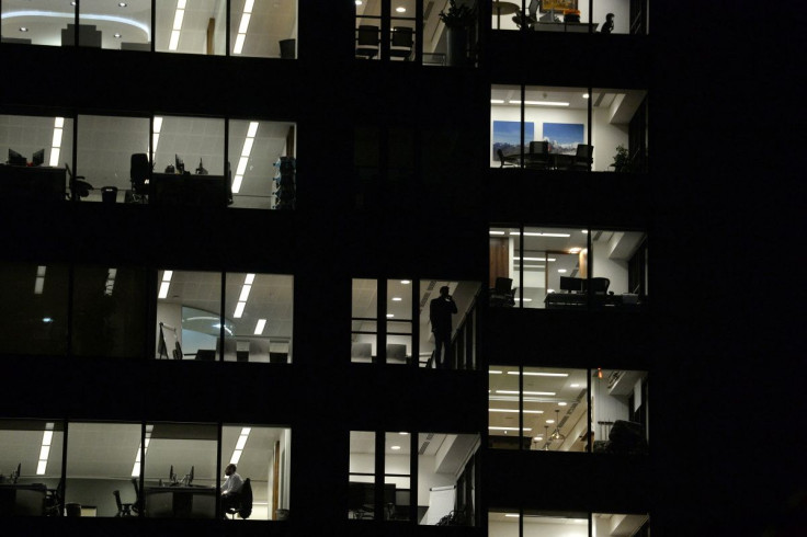 Workers continue working into the night in the City of London, Britain on October 16, 2017. Picture has been rotated 180 degrees. Picture taken October 16, 2017.