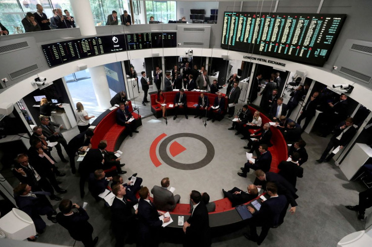 Traders work on the floor of the London Metal Exchange in London, Britain, September 27, 2018. 