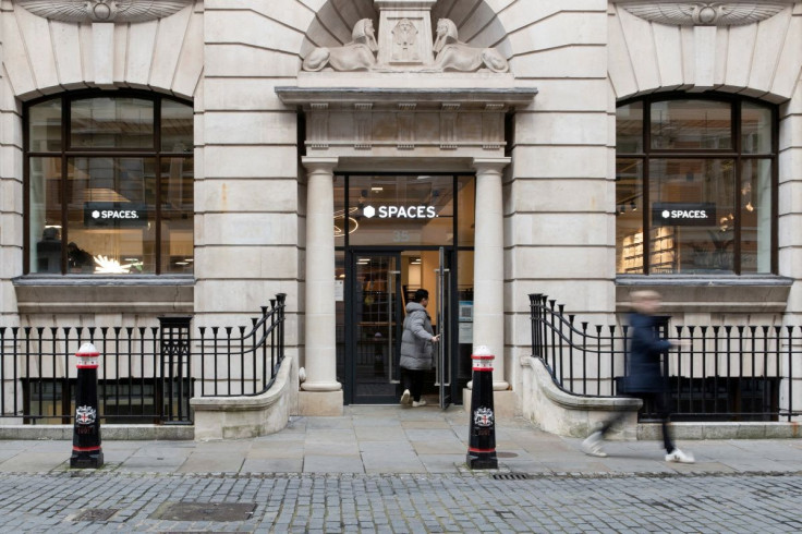 A person enters a Spaces office workspace, an IWG brand, in London, Britain, December 1, 2021.