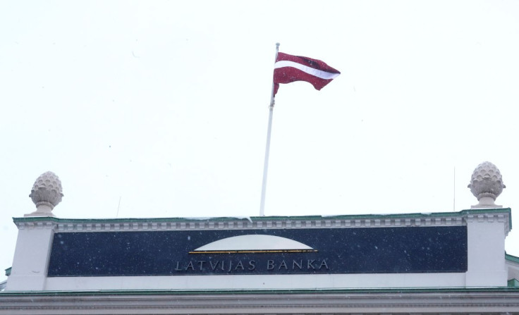 A national flag flutters over the Latvian central bank's headquarters in Riga, Latvia February 18, 2018.