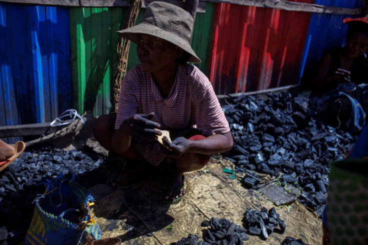 A woman sells charcoal in a market in the town of Ambovombe, in the Androy region, Madagascar, February 14, 2022.