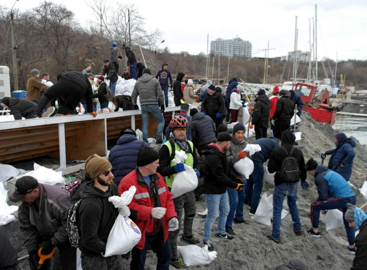 Volunteers fill sandbags to build barricades during Ukraine-Russia conflict, in the city of Odessa, Ukraine March 6, 2022.