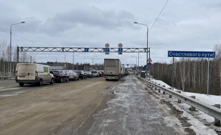 Vehicles line up on the Russia's Burachki border crossing with Latvia's Terehova, Russia March 4, 2022. Picture taken March 4, 2022.