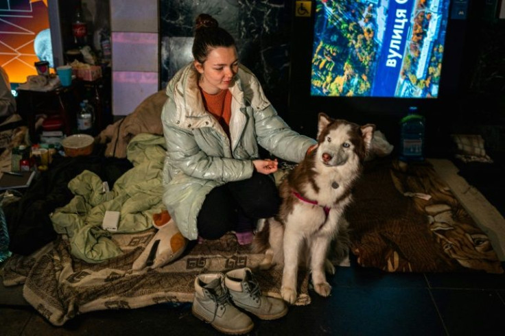 Tania Boyko, 20, and her dog Kari live on a makeshift bed in a Kyiv metro station