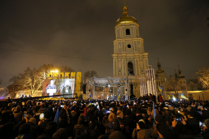 Ukrainian believers gather at the front of the Saint Sophia's Cathedral in Kyiv, Ukraine December 15, 2018. 