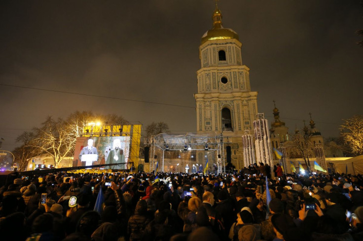 Ukrainian believers gather at the front of the Saint Sophia's Cathedral in Kyiv, Ukraine December 15, 2018.