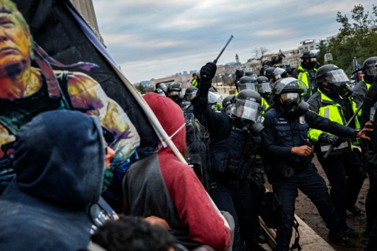 Police officers attempt to push back a pro-Trump mob trying to storm the US Capitol on January 6, 2021