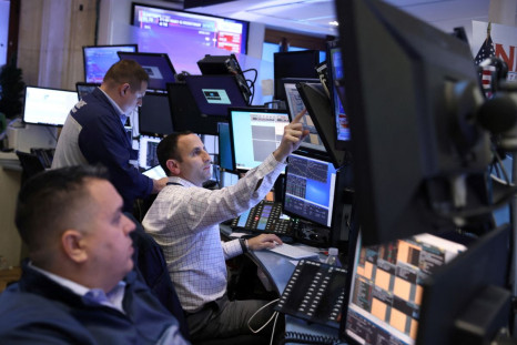 Traders work on the trading floor at the New York Stock Exchange (NYSE) in Manhattan, New York City, U.S., March 7, 2022. 