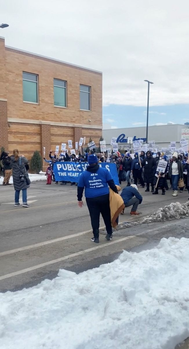 Demonstrators protest on North Broadway Avenue as teachers and teaching-aids unions fail to reach an agreement with the government on a new labor contract in Minneapolis, Minnesota, U.S. March 8, 2022 in this still image from a video obtained from social