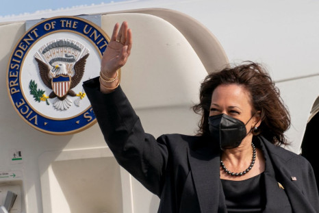 U.S. Vice President Kamala Harris waves as she boards her airplane, to travel back to Washington after attending the Munich Security Conference, at Munich International Airport in Munich, Germany February 20, 2022. Andrew Harnik/Pool via REUTERS