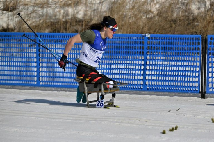 T-shirt weather: Canada's Ethan Hess competes in the men's sprint cross-country on a warm day at the Zhangjiakou National Biathlon Centre