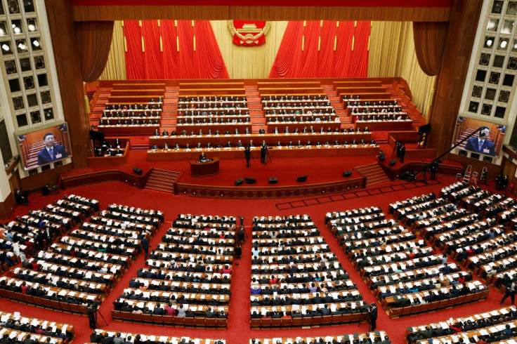 Chinese President Xi Jinping are seen on screens as delegates attend the second plenary session of the National People's Congress (NPC) at the Great Hall of the People in Beijing, China March 8, 2022.