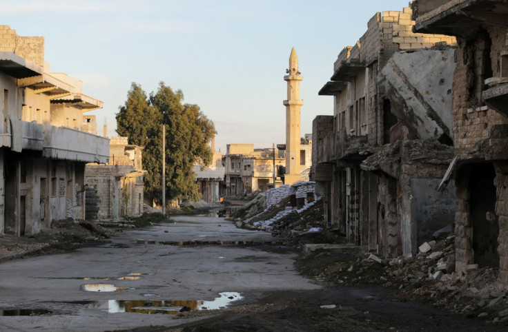 Damaged buildings are pictured along a deserted street in the rebel-held town of Tadef, on a frontline between Russian-backed Syrian government forces and Turkey-backed Syrian rebel-held territory, in northern Syria March 4, 2022. Picture taken March 4, 2