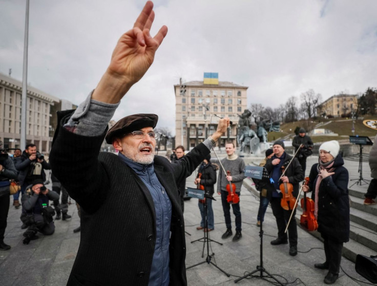 Conductor Herman Makarenko performs during an open-air concert named "Free Sky" at the Independence Square in central Kyiv, Ukraine March 9, 2022.