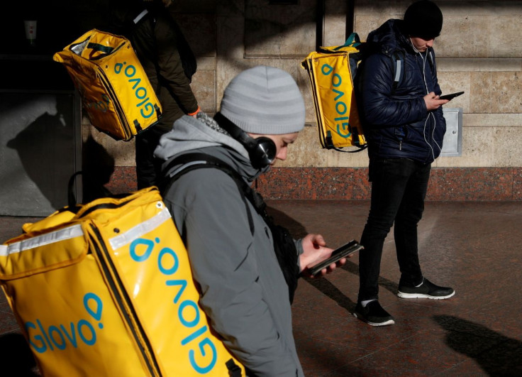 Deliverymen for Glovo wait for an order in central Kiev, Ukraine February 11, 2020.