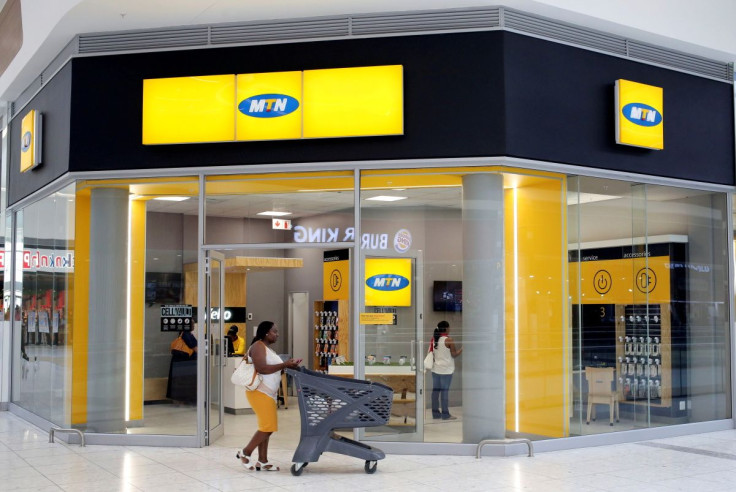 A shopper walks past an MTN shop at a mall in Johannesburg, South Africa, March 2, 2017.