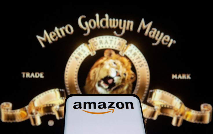 Smartphone with Amazon logo is seen in front of displayed MGM logo in this illustration taken, May 26, 2021. 