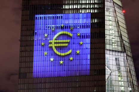 A symphony of light consisting of bars, lines and circles in blue and yellow, the colours of the European Union, illuminates the south facade of the European Central Bank (ECB) headquarters in Frankfurt, Germany, December 30, 2021.   