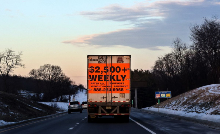 A tractor trailer advertising job opportunities in the trucking industry drives south on Interstate 81 near Staunton, Virginia, U.S., January 22, 2022. Picture taken January 22, 2022. 