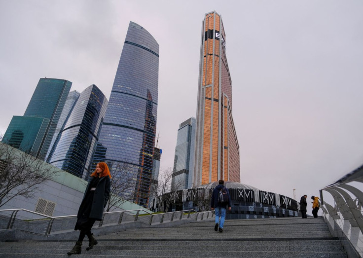 People walk near the Moscow International Business Centre, also known as "Moskva-City", in Moscow, Russia November 12, 2019. 