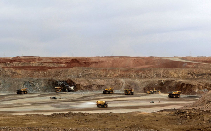 Mining trucks are seen at the Oyu Tolgoi mine in Mongolia's South Gobi region June 23, 2012.  