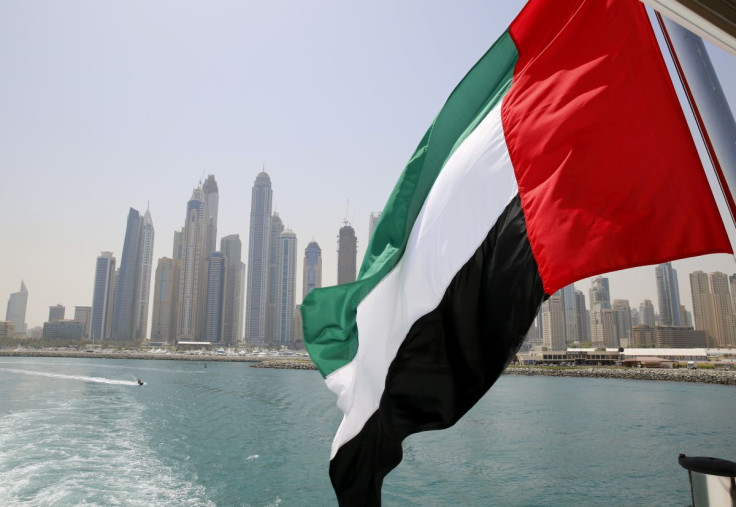 UAE flag flies over a boat at Dubai Marina, Dubai, United Arab Emirates May 22, 2015. 