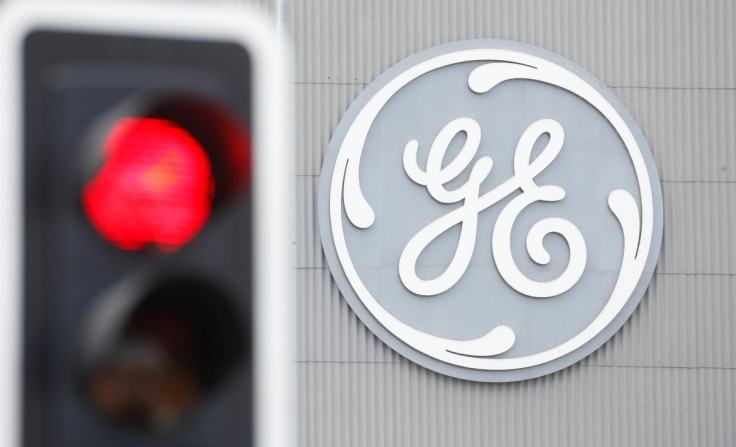 A traffic light is seen in front of a logo of General Electric at the company's plant in Birr, Switzerland June 17, 2019. 