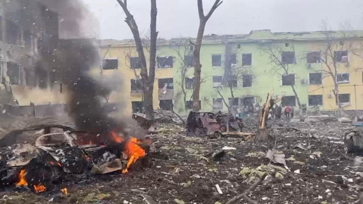 A view shows cars and a building of a hospital destroyed by an aviation strike amid Russia's invasion of Ukraine, in Mariupol, Ukraine, in this handout picture released March 9, 2022.  Press service of the National Police of Ukraine/Handout via REUTERS