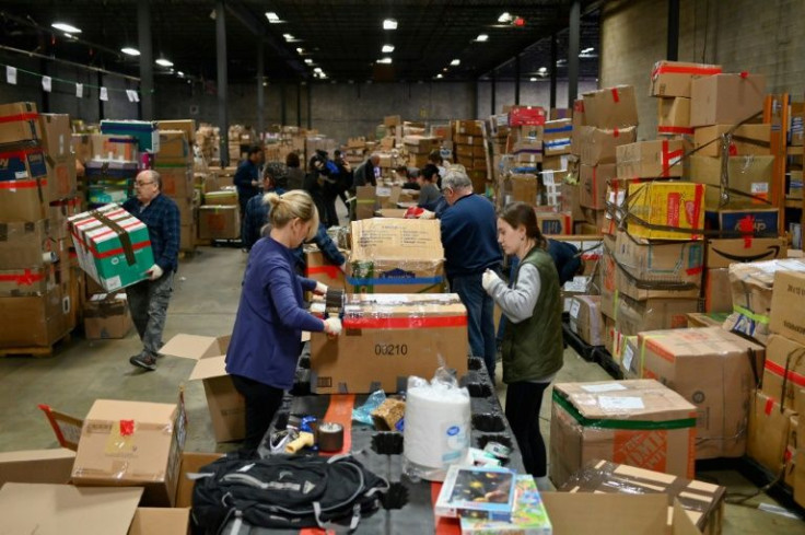 Employees and volunteers sort boxes of humanitarian aid in a New Jersey warehouse run by Meest, a company which specializes in sending parcels to Eastern Europe