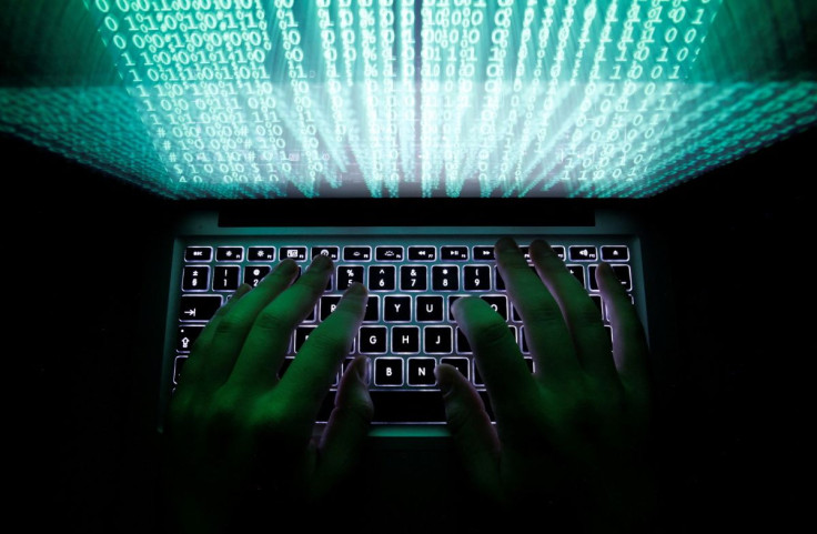 A man types on a computer keyboard in Warsaw in this February 28, 2013 illustration picture.