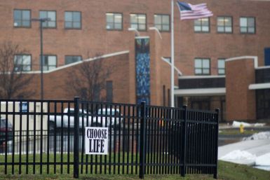 An anti-abortion sign hangs on a fence in front of Covington Catholic High School in Park Hills, Kentucky, U.S., January 23, 2019.  