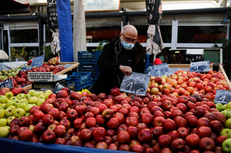 President of the federation of street market producers, Pantelis Moschos, waits for customers at a farmers market in Athens, Greece, February 10, 2022. Picture taken February 10, 2022. 