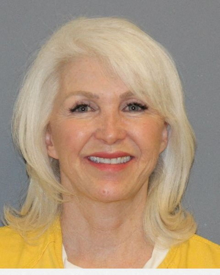 Tina Peters, the Mesa County, Colorado, clerk indicted on multiple felony counts stemming from an election security breach, poses in a jail booking photograph in Grand Junction, Colorado, U.S. March 9, 2022.  Mesa County Sheriff's Office/Handout via REUTE