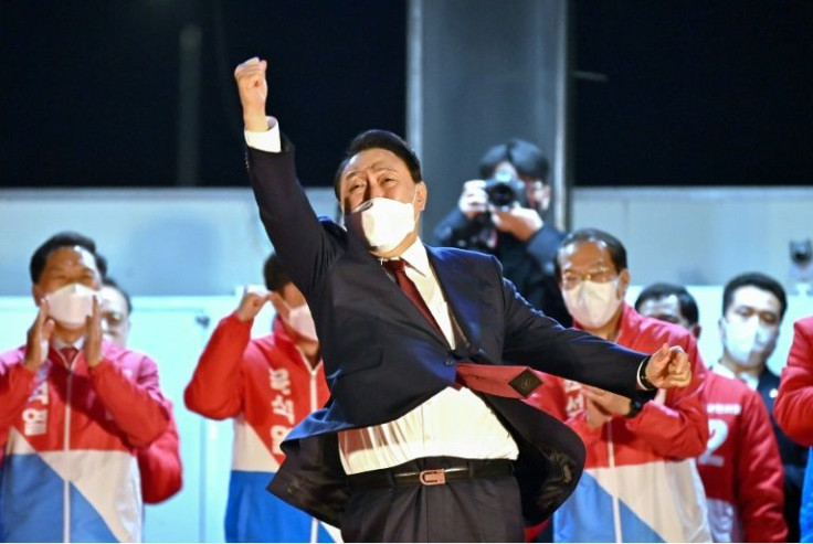South Korea's new president-elect Yoon Suk Yeol (C) has promised to get tough on North Korea
