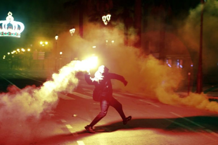 Protesters threw flares and Molotov cocktails at government buildings