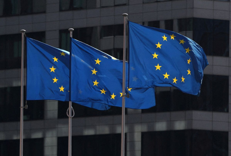 European Union flags fly outside the European Commission headquarters in Brussels, Belgium, April 10, 2019. 