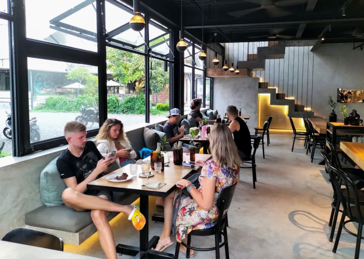 Visitors are seen inside a cafe frequently visited by the Russians in Badung regency, Bali, Indonesia, March 8, 2022. Picture taken March 8, 2022. 