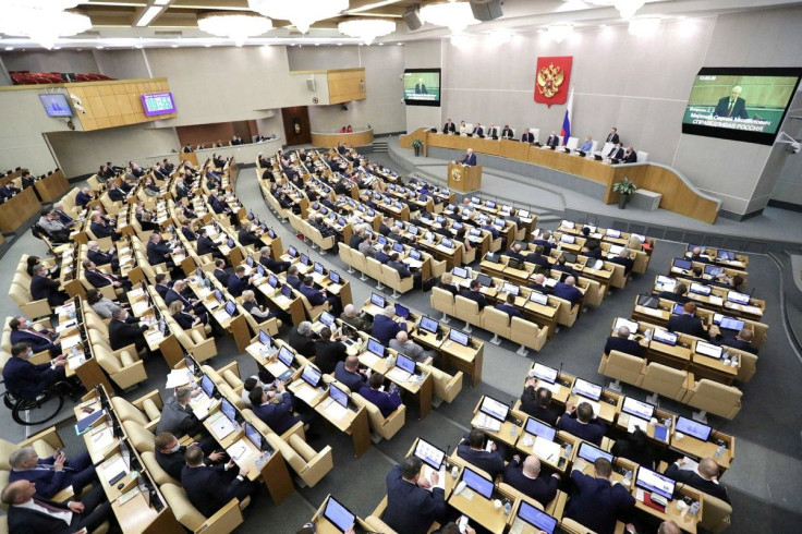 Russian lawmakers attend a session of the State Duma, the lower house of parliament, to consider approving friendship treaties with two self-proclaimed people's republics in eastern Ukraine, in Moscow, Russia February 22, 2022. Russian State Duma/Handout