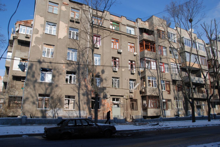 A person walks past the "Slovo" building, amid Russia's invasion of Ukraine, in Kharkiv, Ukraine, March 10, 2022.