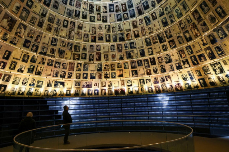 A man looks up at pictures of victims of the Holocaust ahead of International Holocaust Remembrance Day, at the Hall of Names at Yad Vashem Holocaust memorial centre in Jerusalem January 26, 2022. 