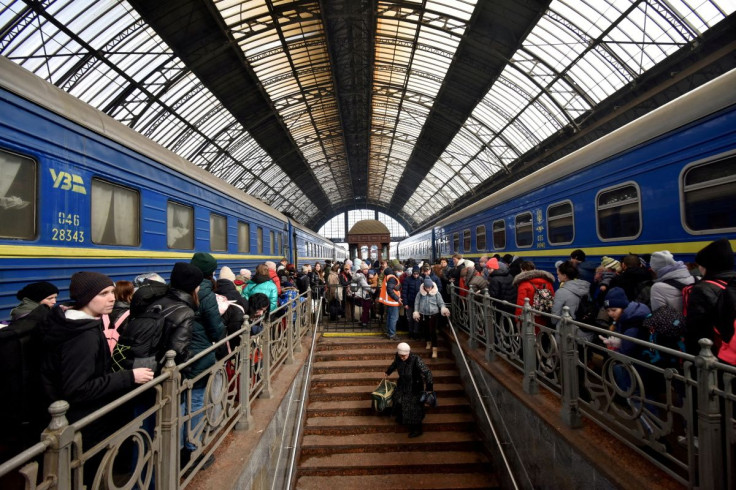 People fleeing Russia's invasion of Ukraine gather at the train station in Lviv, Ukraine, March 9, 2022. 