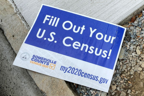 A sign encouraging participation in the U.S. Census lies on a sidewalk in Somerville, Massachusetts, U.S., August 4, 2020.   