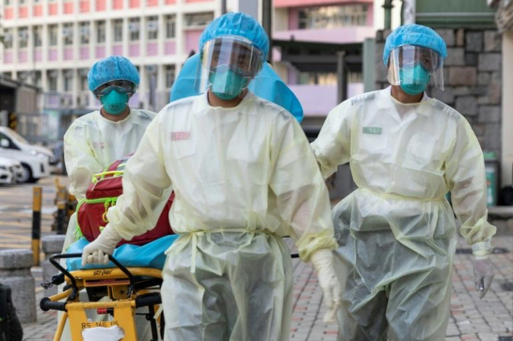 Medical staff enter a care home in Hong Kong