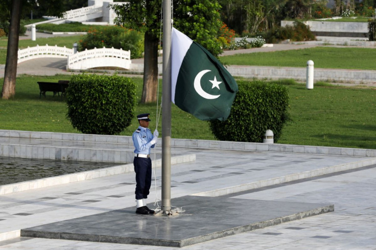 A member of the Pakistan Air Force (PAF) rehearses flag masting at the mausoleum of Muhammad Ali Jinnah before the Defence Day ceremonies, or Pakistan's Memorial Day, in Karachi, Pakistan September 6, 2020.